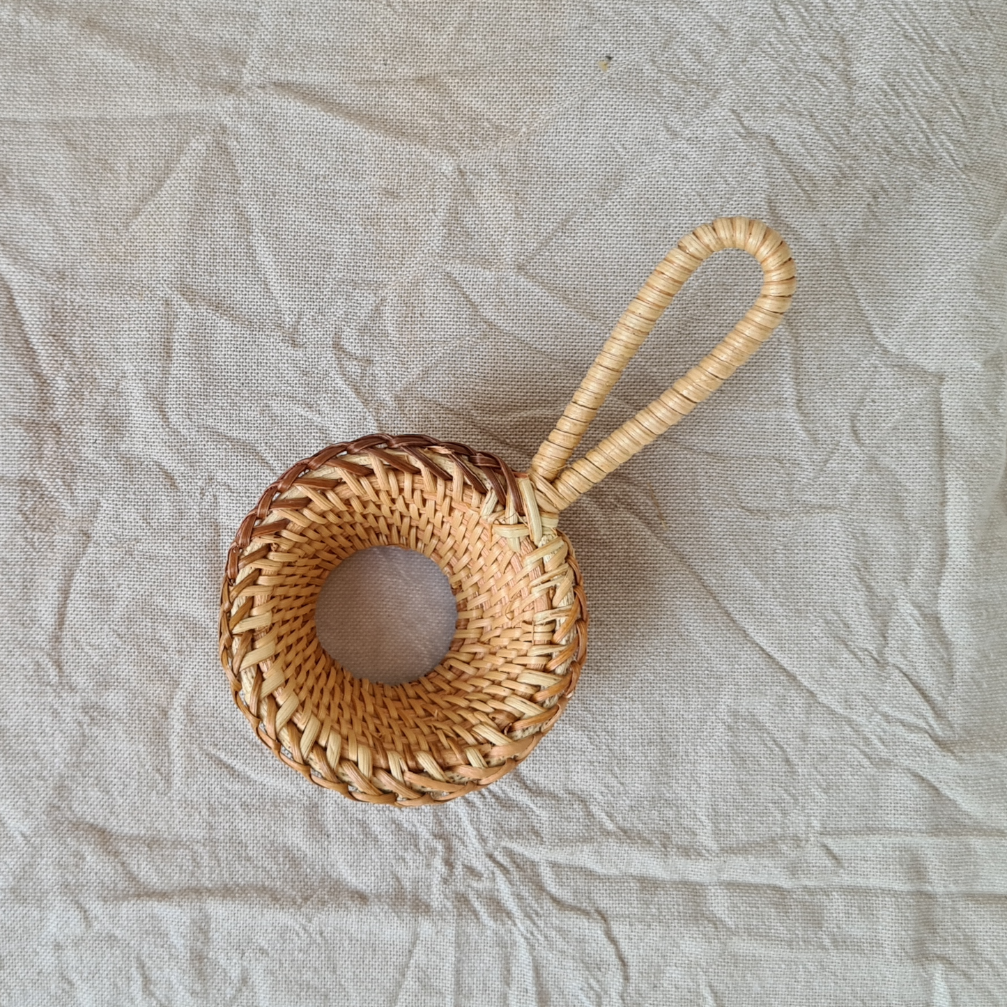Woven bamboo round tea strainer with handle. Mesh bottom. Natural bamboo colour 